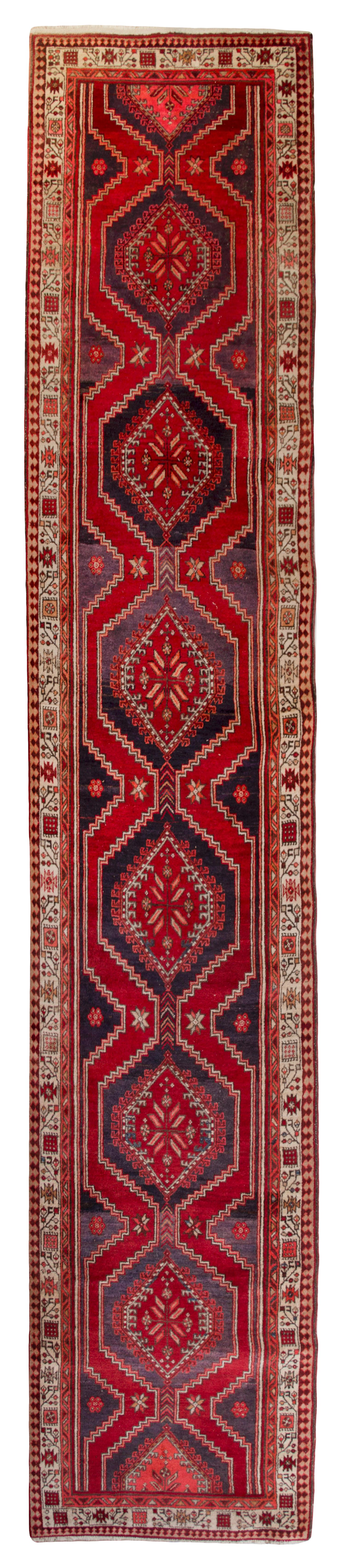 A Caucasian Style Wool Runner 14 feet 3 inches x 3 feet 4 1/2 inches.