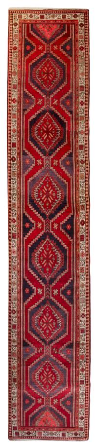 A Caucasian Style Wool Runner 14 feet 3 inches x 3 feet 4 1/2 inches.