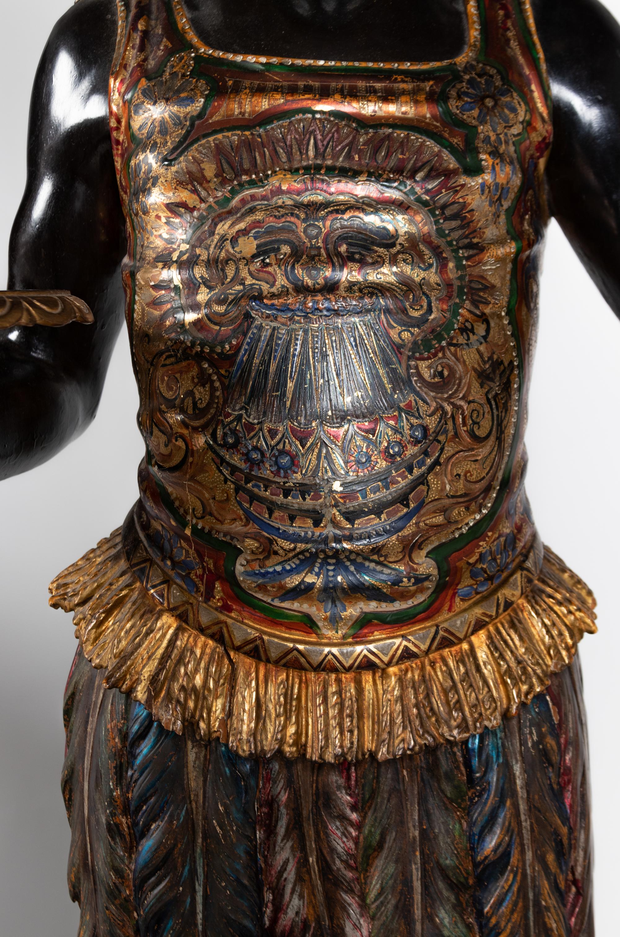 A Venetian Parcel-Gilt and Ebonized Attendant