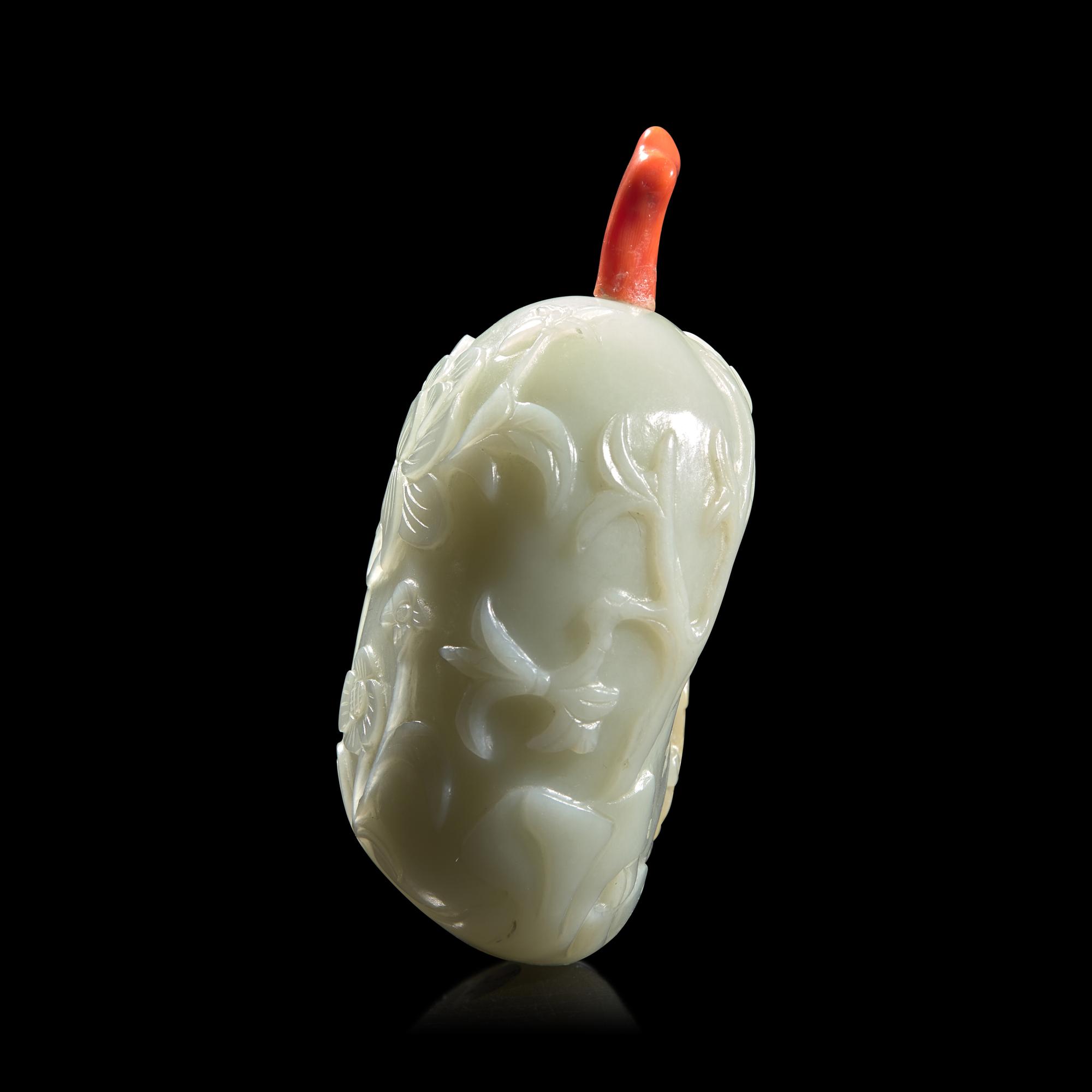 A Chinese Carved Celadon and Russet Jade Snuff Bottle