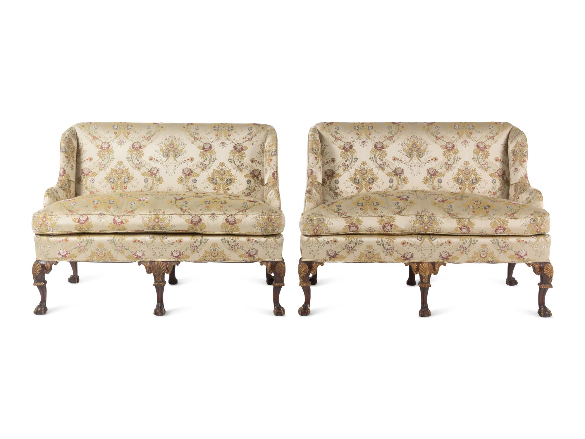A Pair of George II Style Parcel-Gilt Walnut Settees