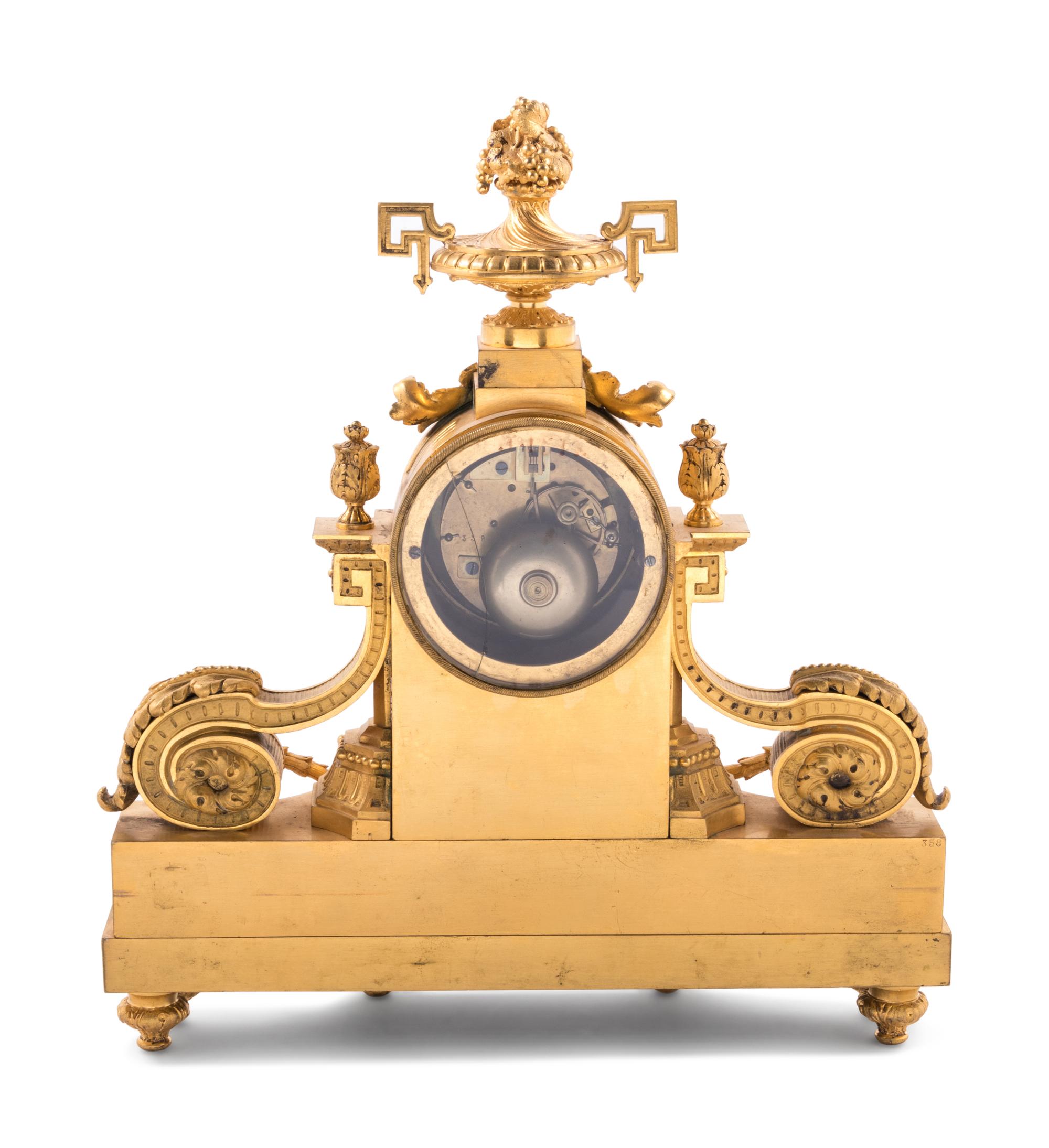 A Louis XVI Style Malachite and Gilt Bronze Mantel Clock