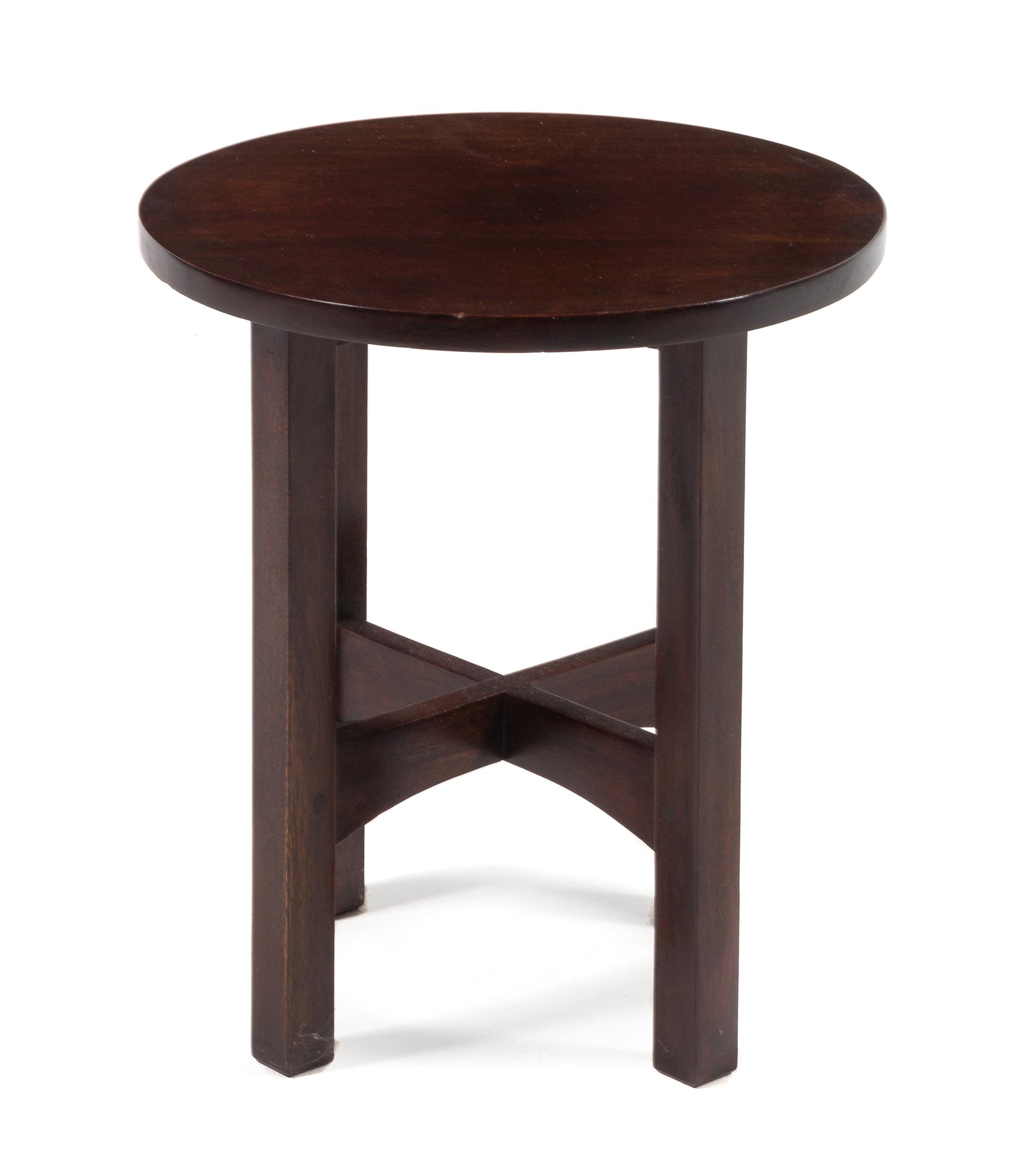 Gustav Stickley, (American, 1858-1942), a mahogany tabouret, model no. 602, having a circular top raised on squared legs joined by stre