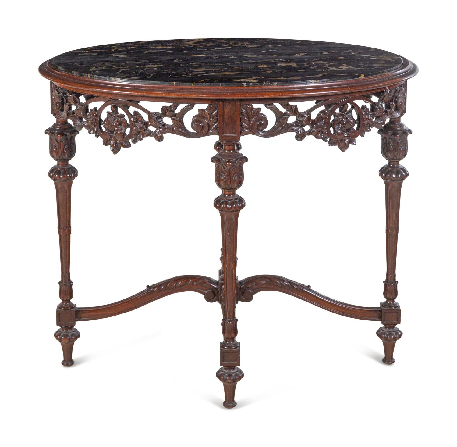An Italian Carved Walnut Marble-Top Table