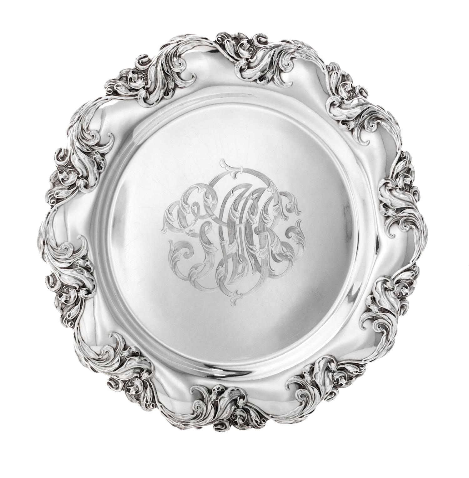 An American Silver Platter, Mauser Mfg. Co., New York, NY, 1900, retailed by Lebolt & Co., of shaped circular form with a bold foliate