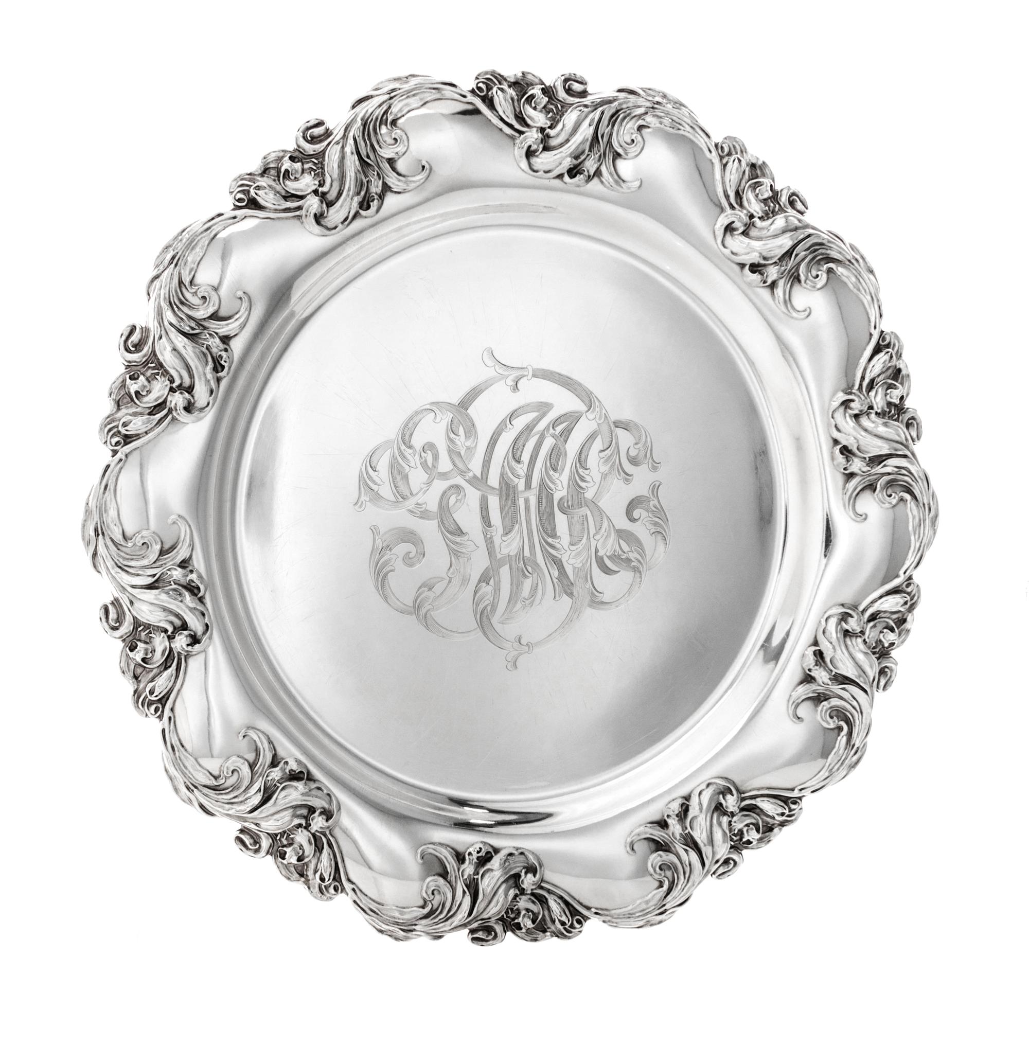 An American Silver Platter, Mauser Mfg. Co., New York, NY, 1900, retailed by Lebolt & Co., of shaped circular form with a bold foliate