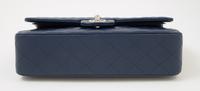 A Chanel Navy Caviar Classic Double Flap Handbag, 10" x 6" x 2.5"; Strap Drop: 9.5".