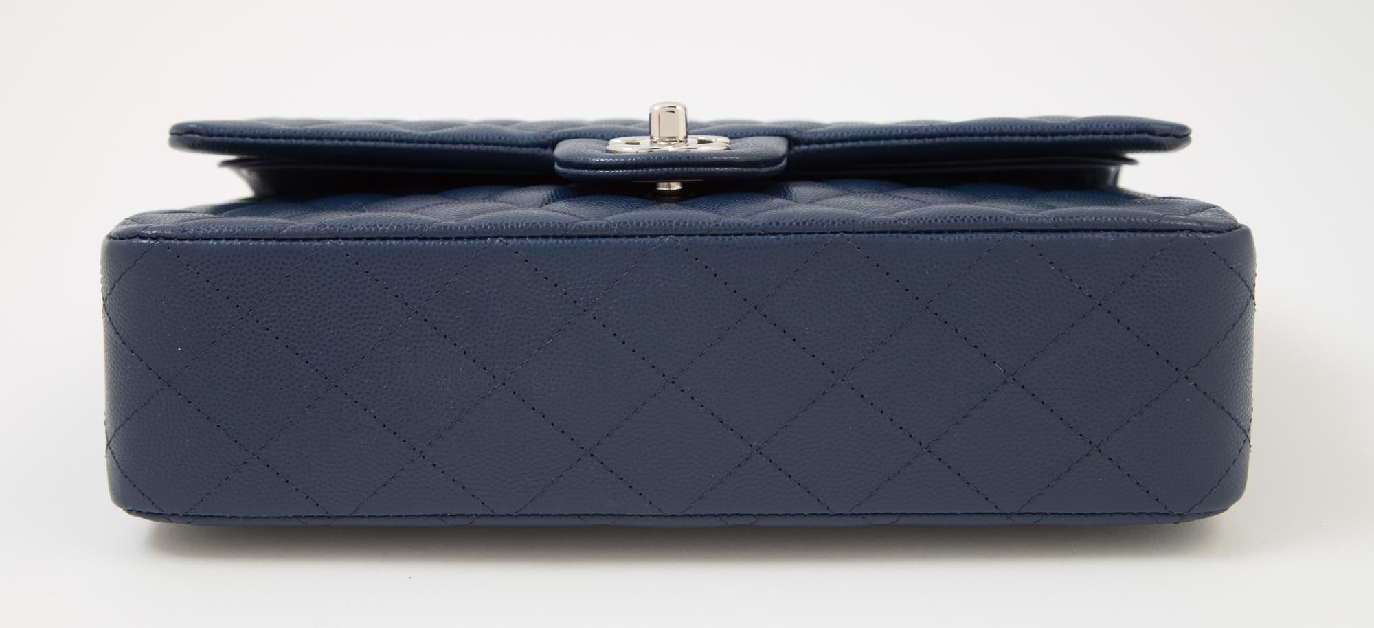 A Chanel Navy Caviar Classic Double Flap Handbag, 10" x 6" x 2.5"; Strap Drop: 9.5".