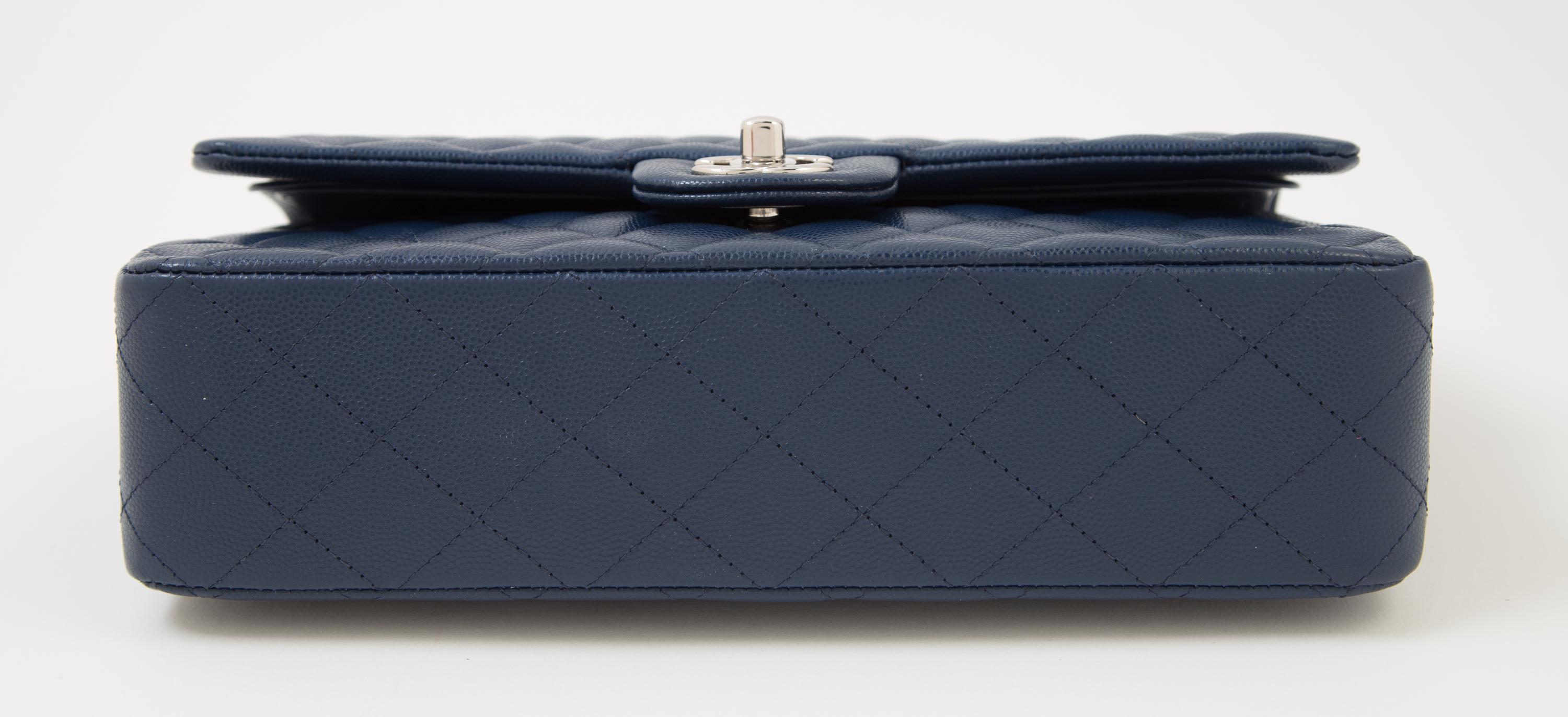 A Chanel Navy Caviar Classic Double Flap Handbag, 10" x 6" x 2.5"; Strap Drop: 9.5".