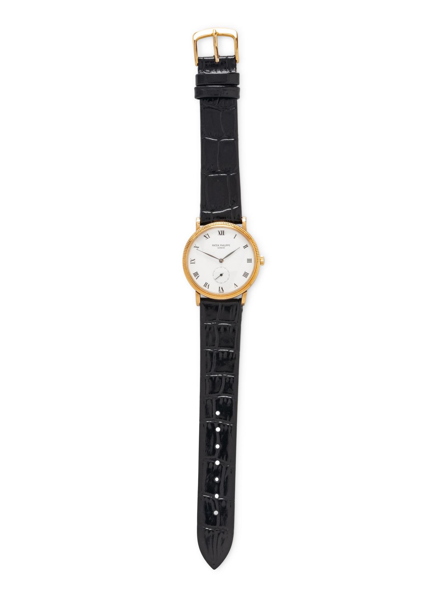 PATEK PHILIPPE, REF. 3919J 18K YELLOW GOLD 'CALATRAVA' WATCH, BOX & PAPERS