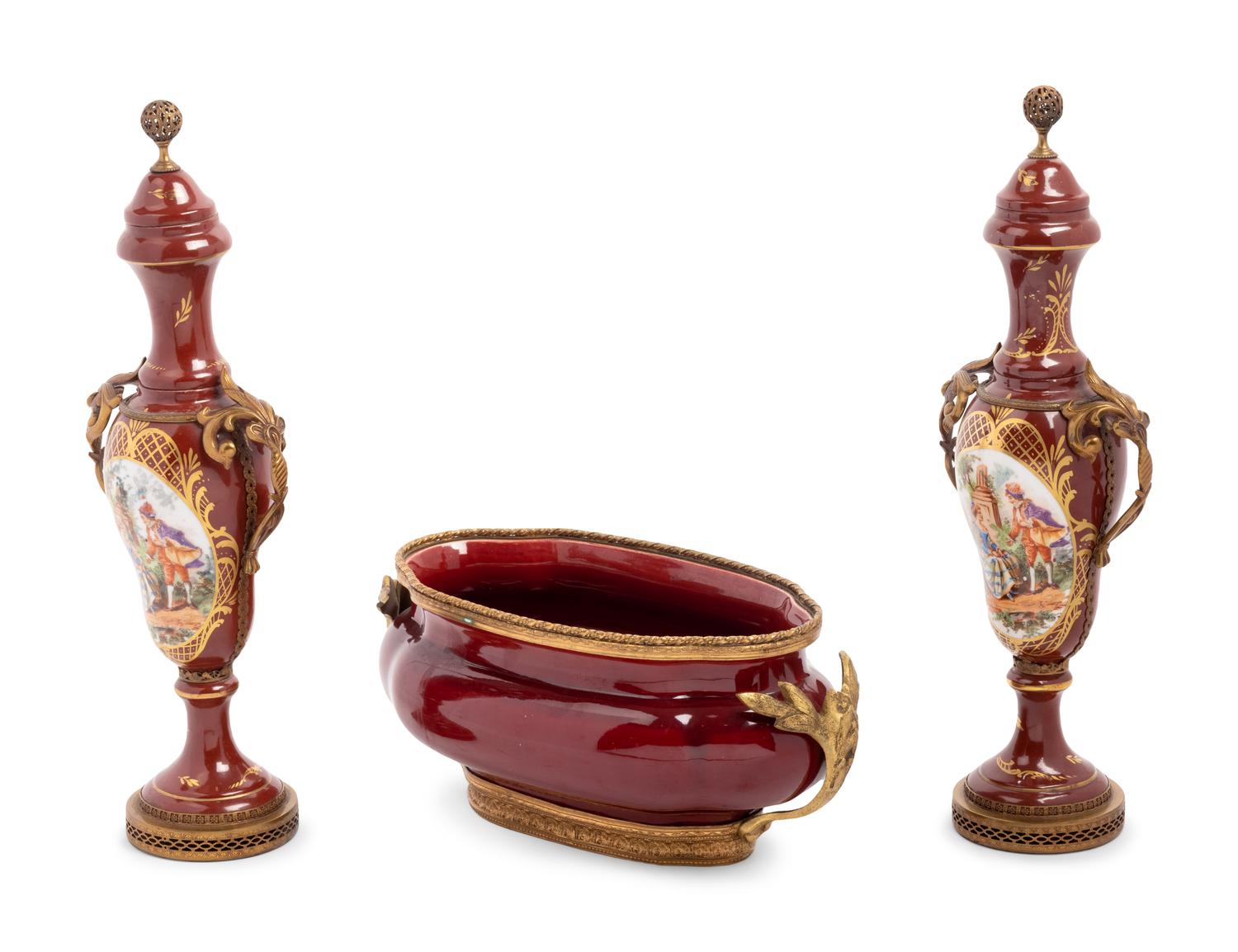 An Assembled French Gilt Metal Mounted Porcelain and Pottery Garniture