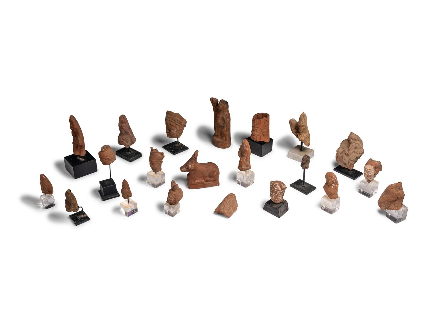 Twenty-One Egyptian Terracotta Heads and Figures