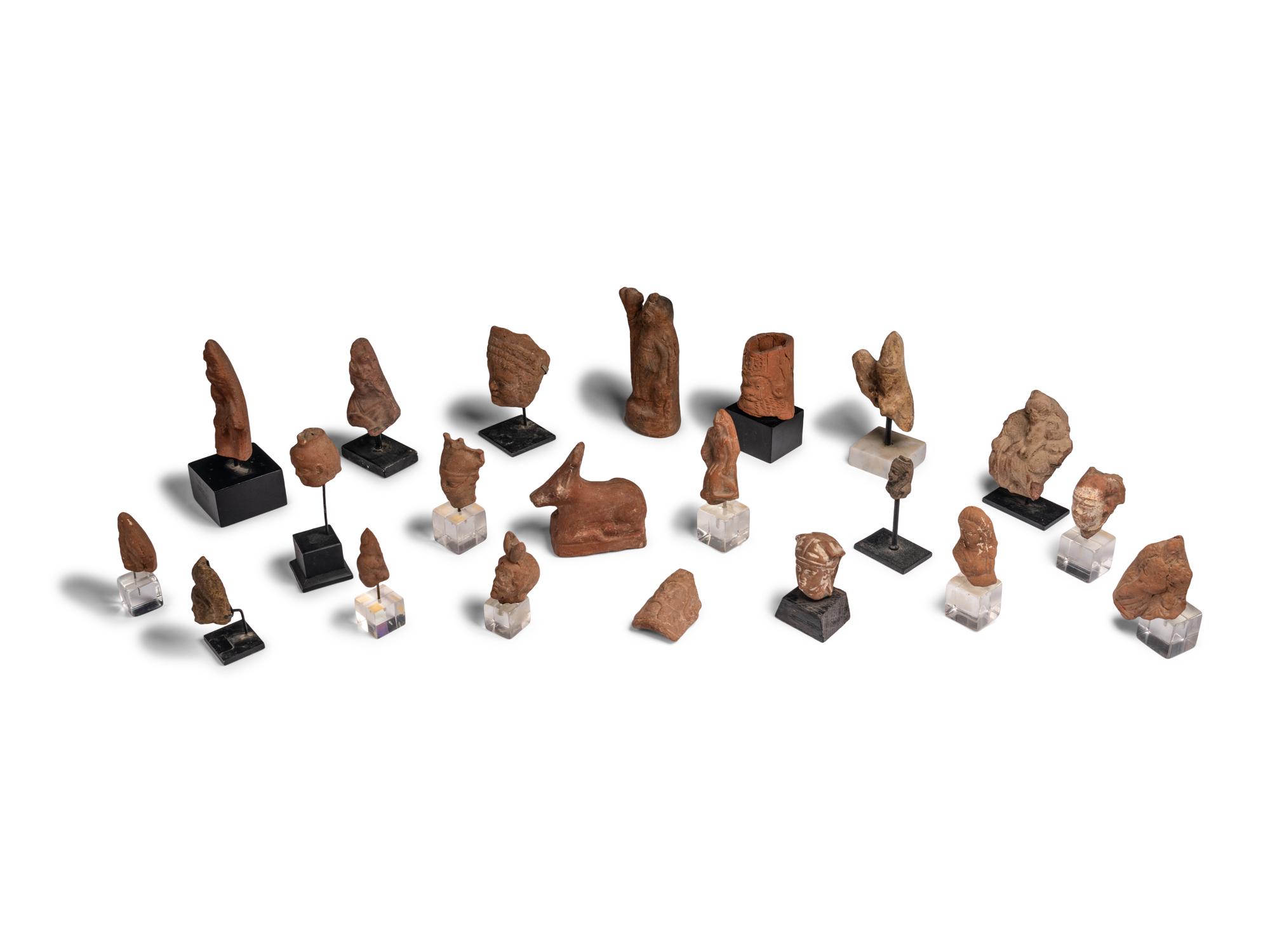 Twenty-One Egyptian Terracotta Heads and Figures