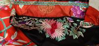 A Red Ground Embroidered Silk Manchu Lady's Robe