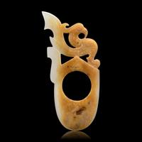 A Chinese Archaistic White and Russet Jade Ring-Form Pendant 白玉鳳紋韘形佩