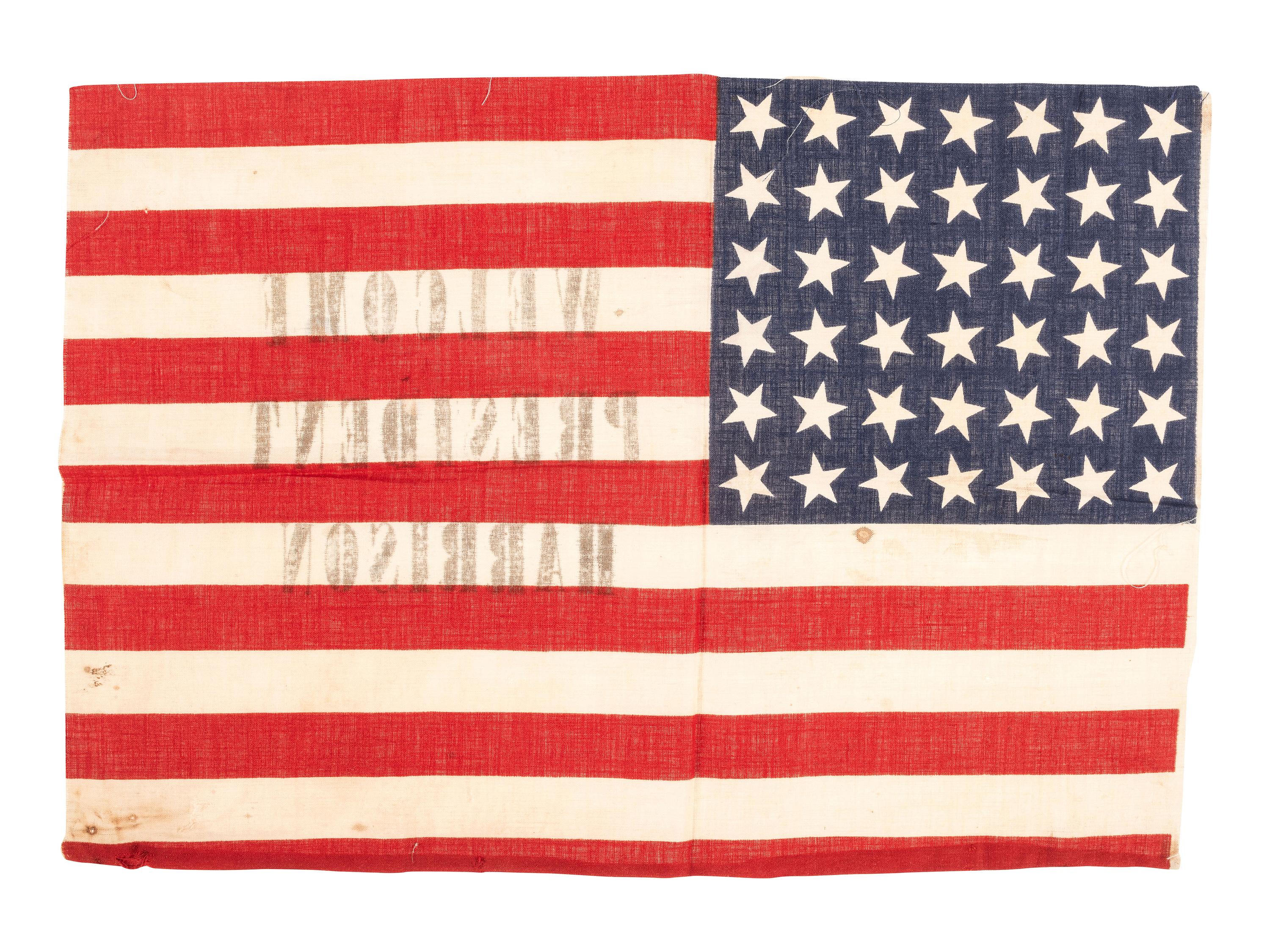 [FLAGS & PATRIOTIC TEXTILES - HARRISON, Benjamin (1833-1901)]. "Welcome President Harrison" parade flag. Ca 1889-1890.