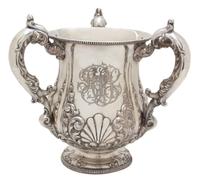 An American Silver Loving Cup, Bailey, Banks & Biddle, Philadelphia, PA, having three C-scroll handles; the urn form body with raised s