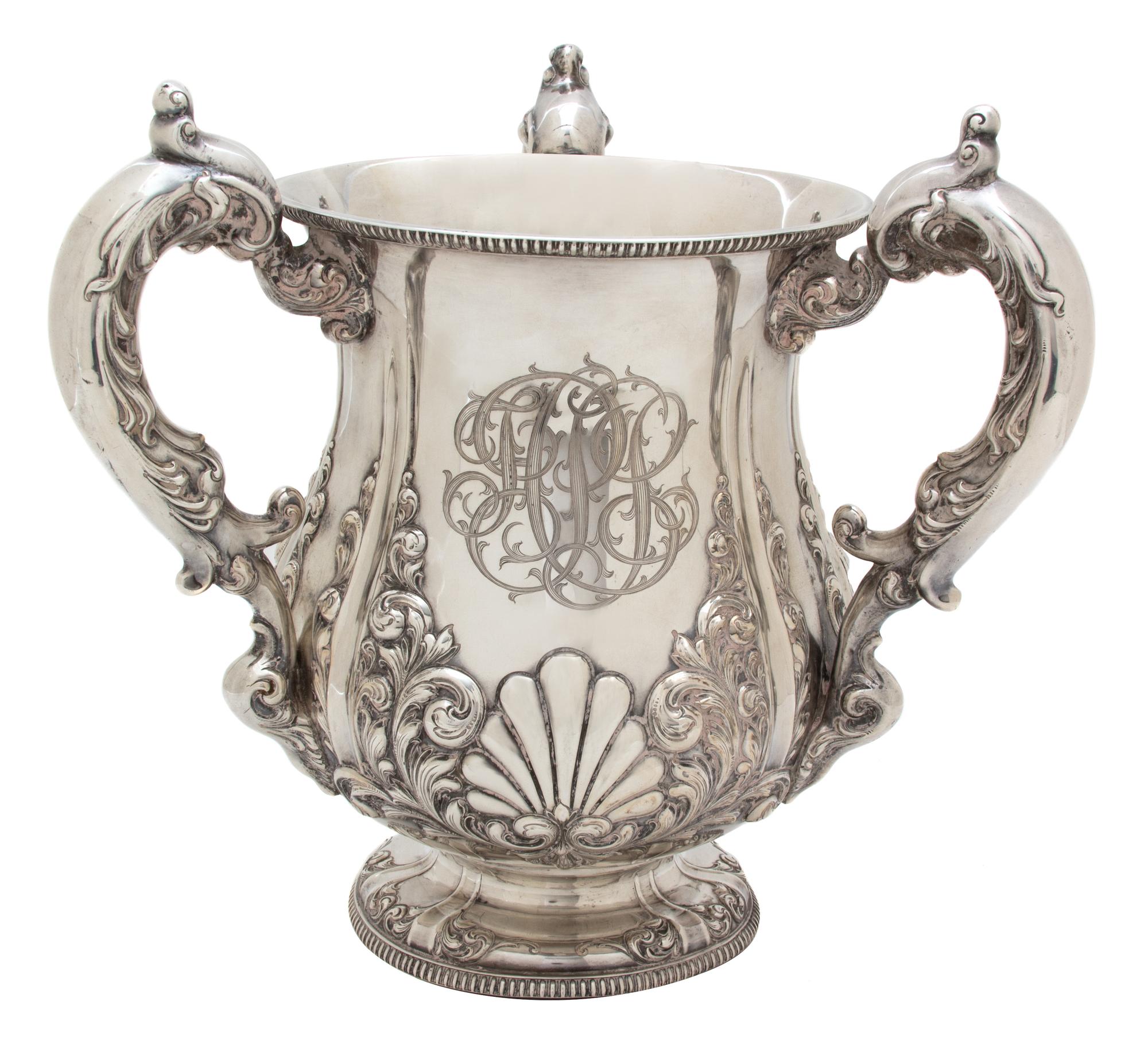 An American Silver Loving Cup, Bailey, Banks & Biddle, Philadelphia, PA, having three C-scroll handles; the urn form body with raised s