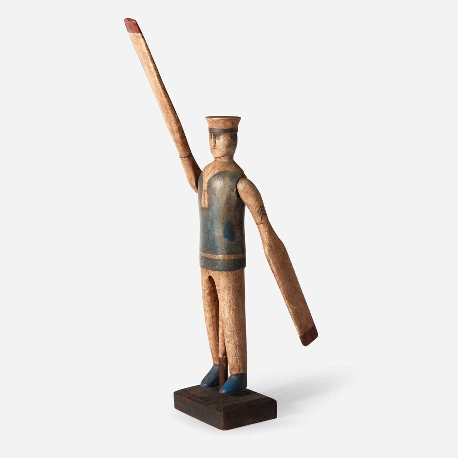 A carved and painted wood sailor whirligig