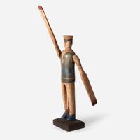A carved and painted wood sailor whirligig