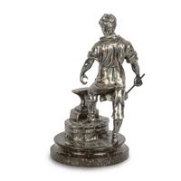 A Czech Silvered Metal Figure of a Blacksmith