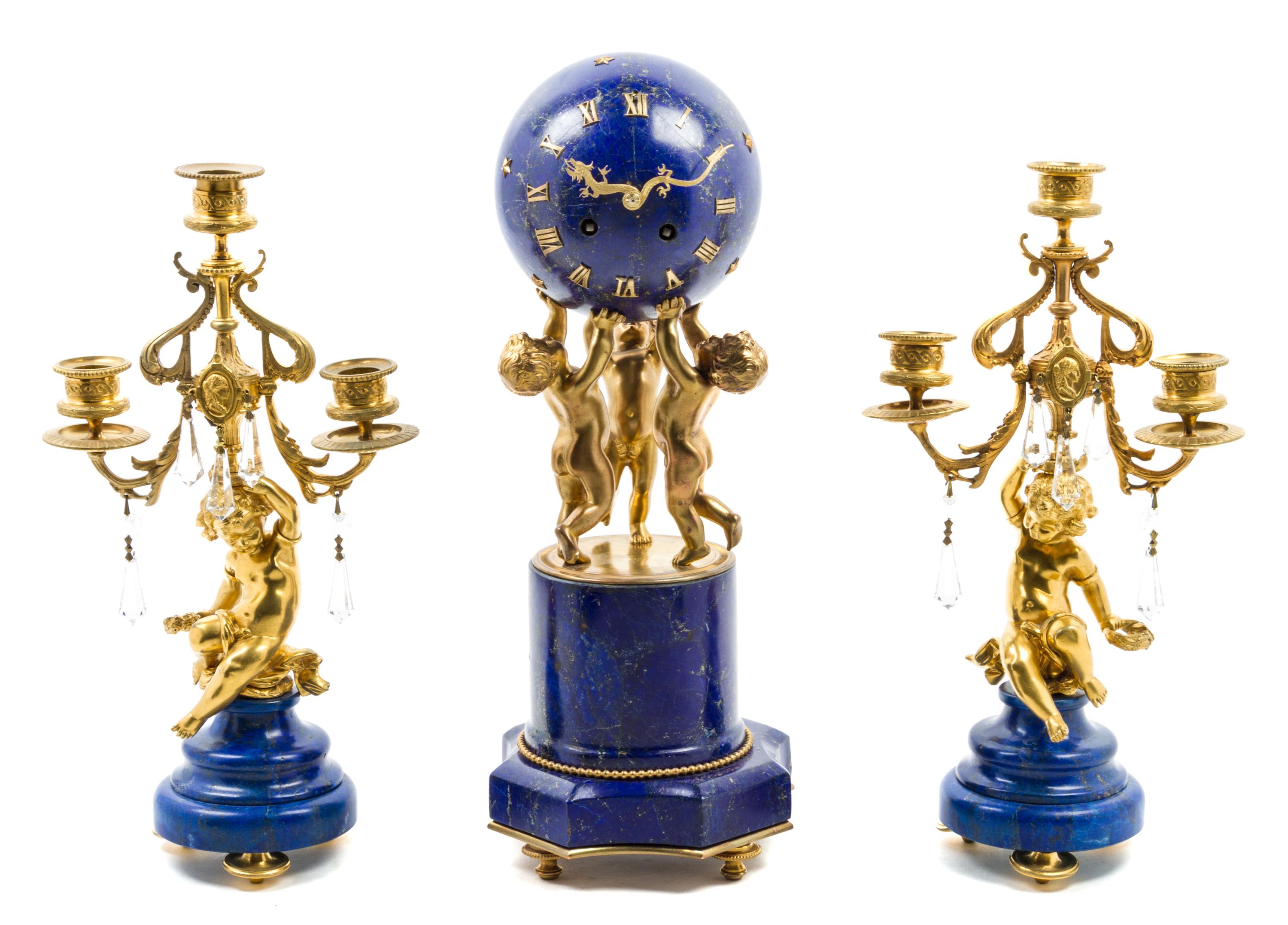 A French Gilt Bronze and Lapis Lazuli Clock Garniture Height of clock 16 inches. — 19TH CENTURY