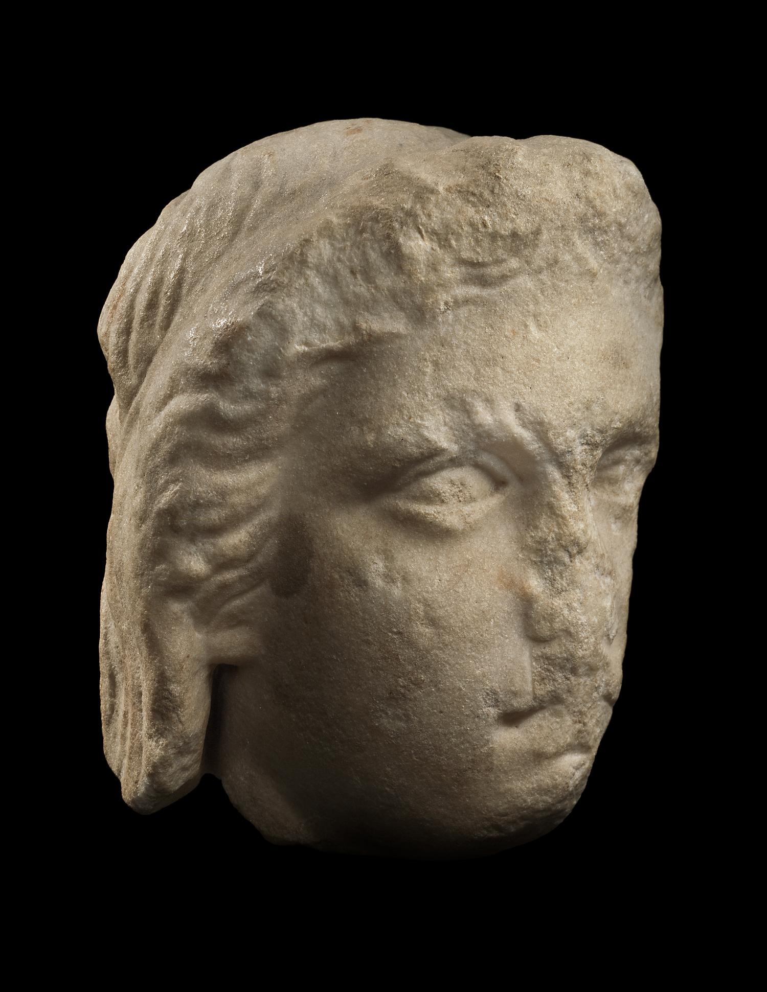 A Greek Fragmentary Marble Male Head