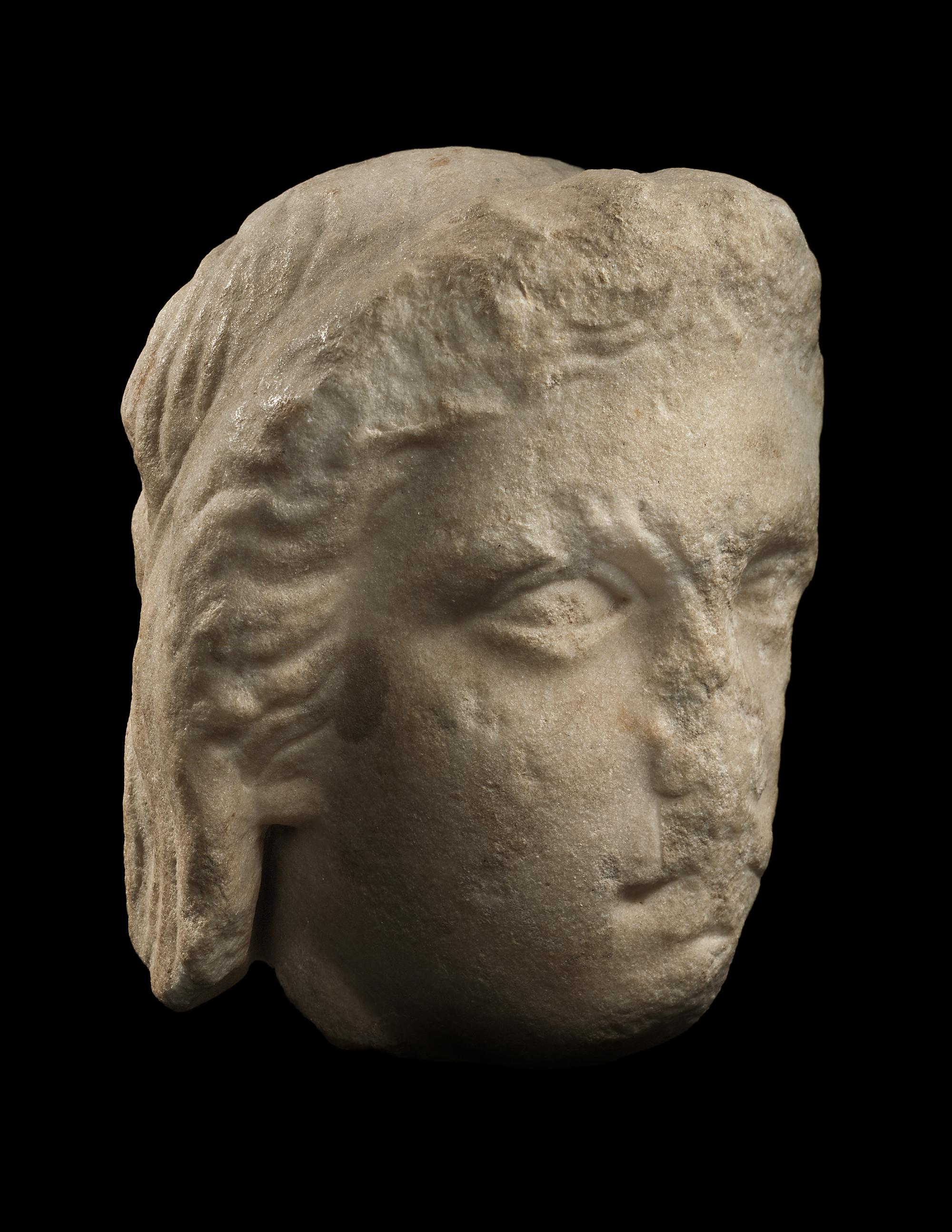 A Greek Fragmentary Marble Male Head