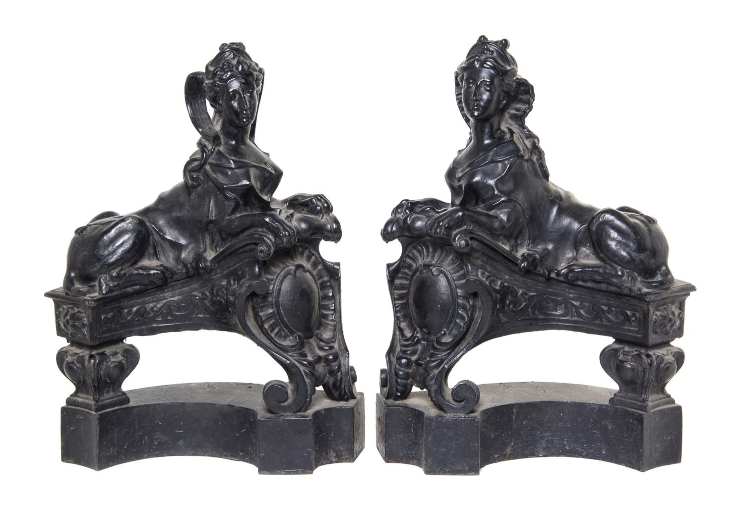A Pair of English Cast Iron Chenets, Height 21 1/4 inches.