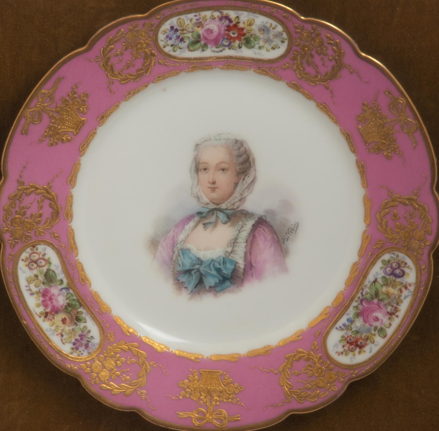 A Group of Seven Framed Sèvres Style Porcelain Plates