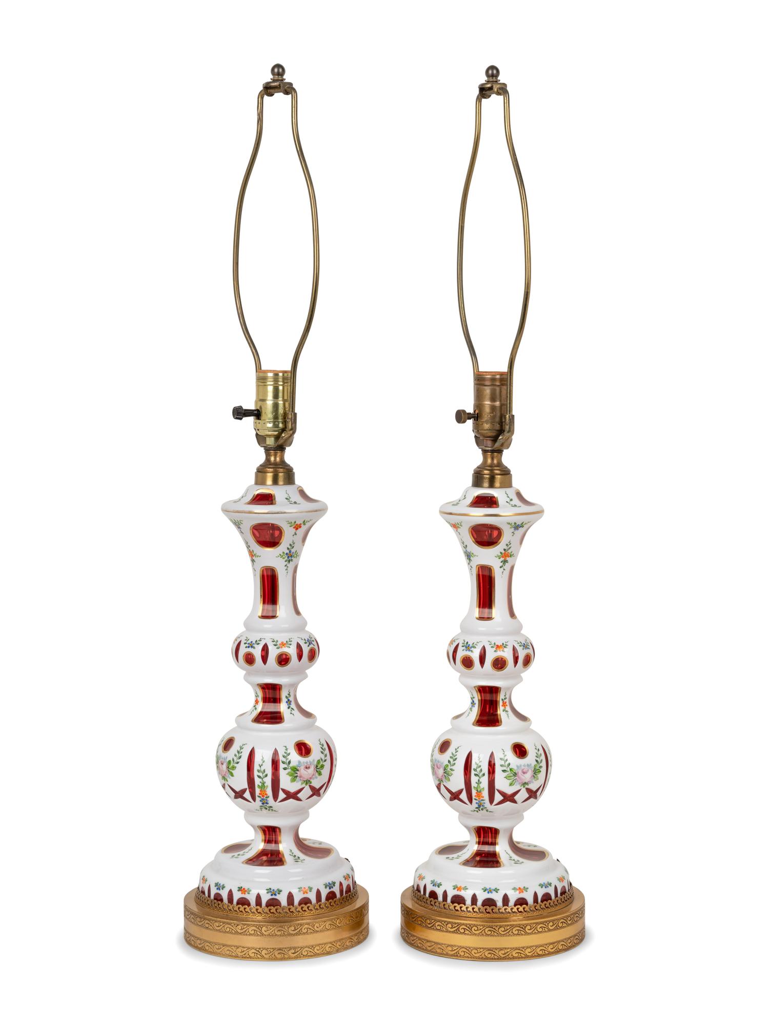 A Pair of Bohemian Enameled White Overlay Ruby Glass Lamps