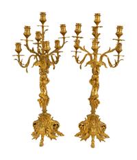 A Pair of Gilt Bronze Figural Seven-Light Candelabra