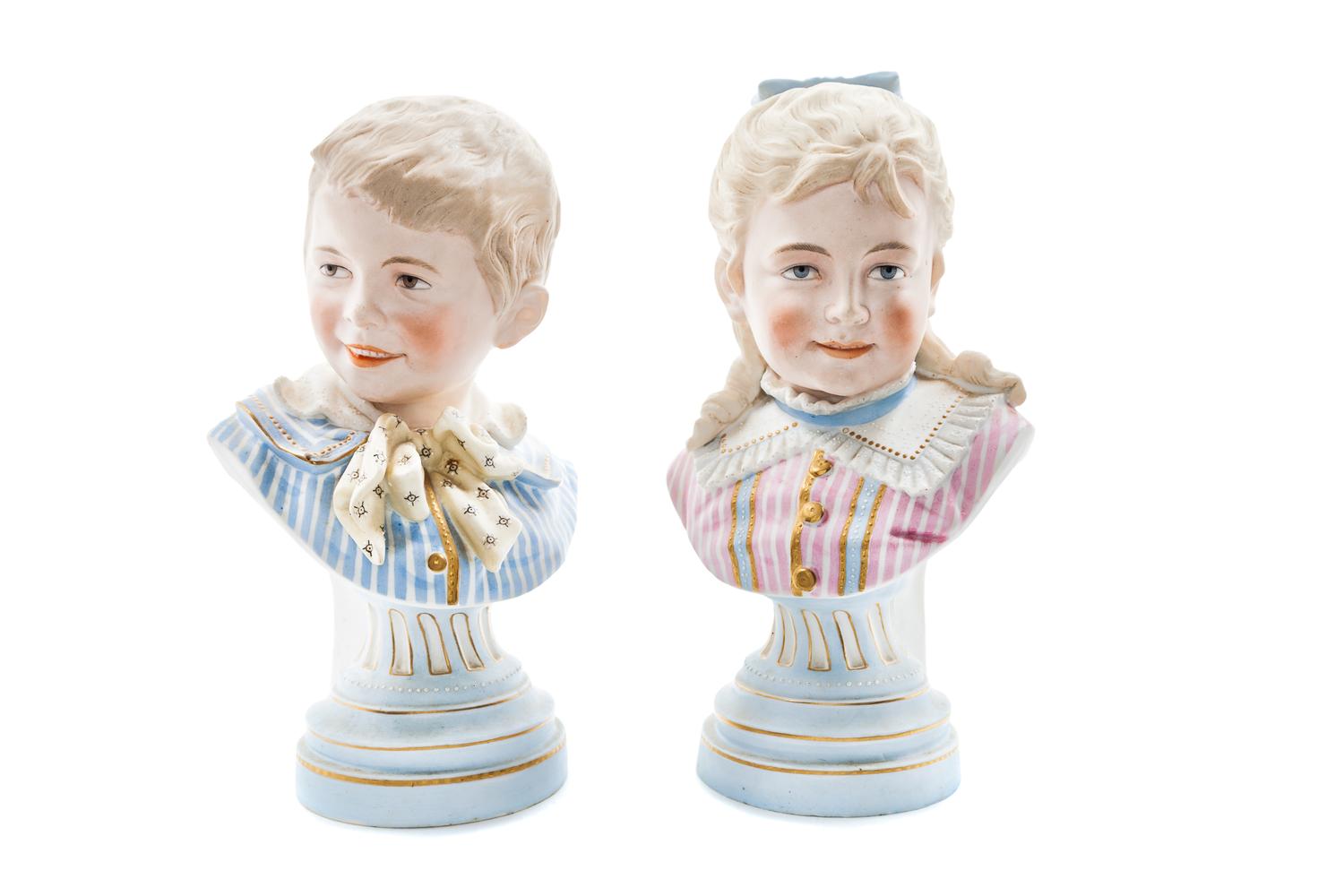 A Pair of Continental Bisque Busts Height 10 inches. — 20TH CENTURY