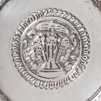 A Silver Box and Cover, Probably Thai, 20th Century, of circular form with allover repeating relief decoration.