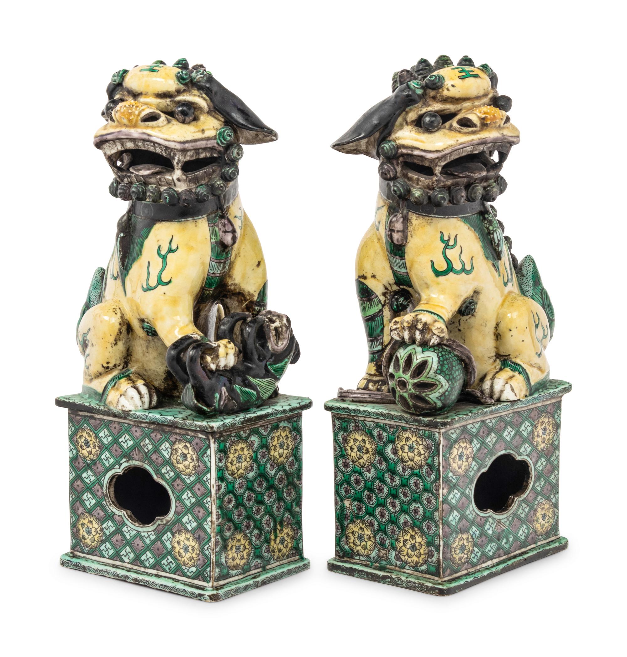 A Pair of Chinese Famille Verte Porcelain Figures of Fu Lions