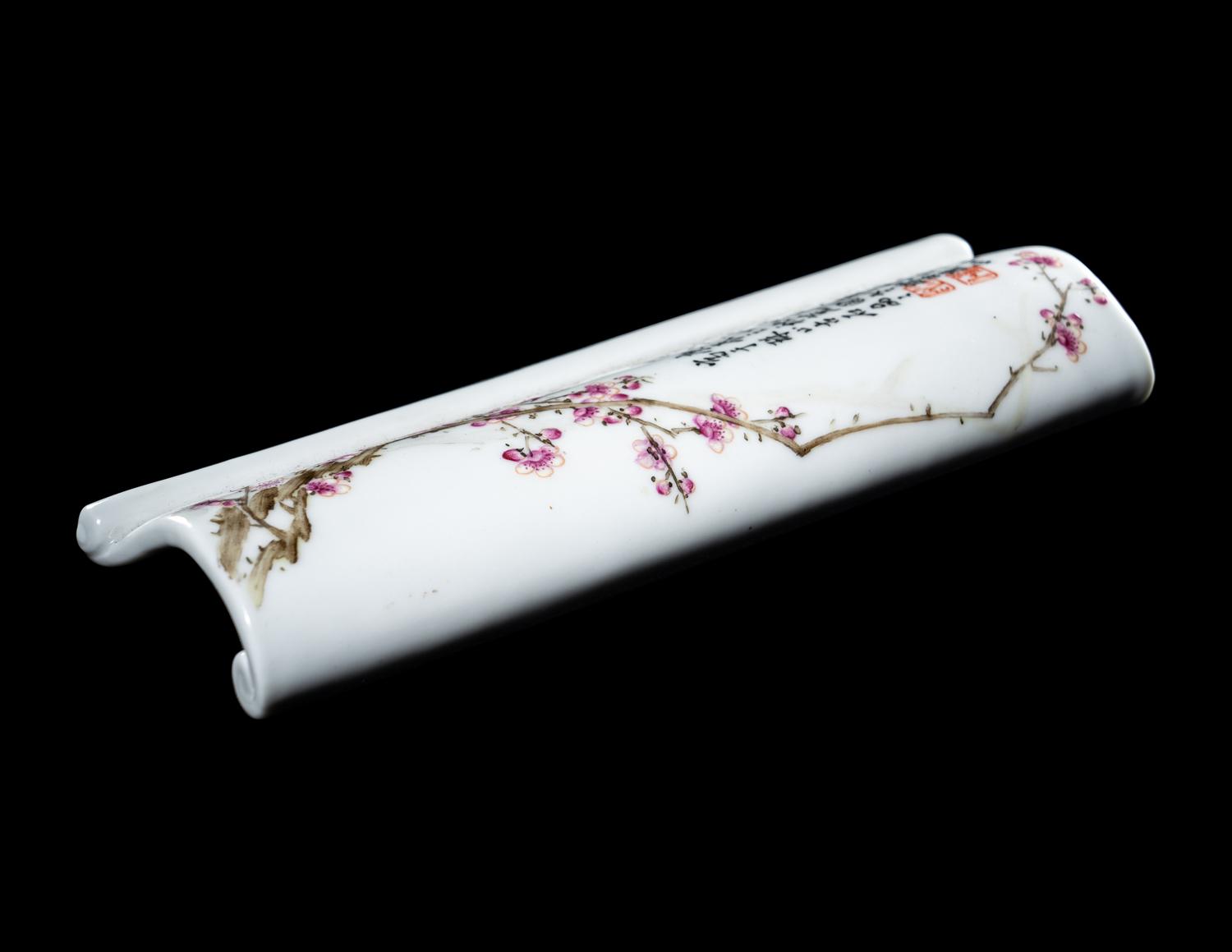A Famille Rose Porcelain Scroll-Form Wrist Rest