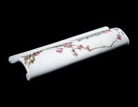 A Famille Rose Porcelain Scroll-Form Wrist Rest