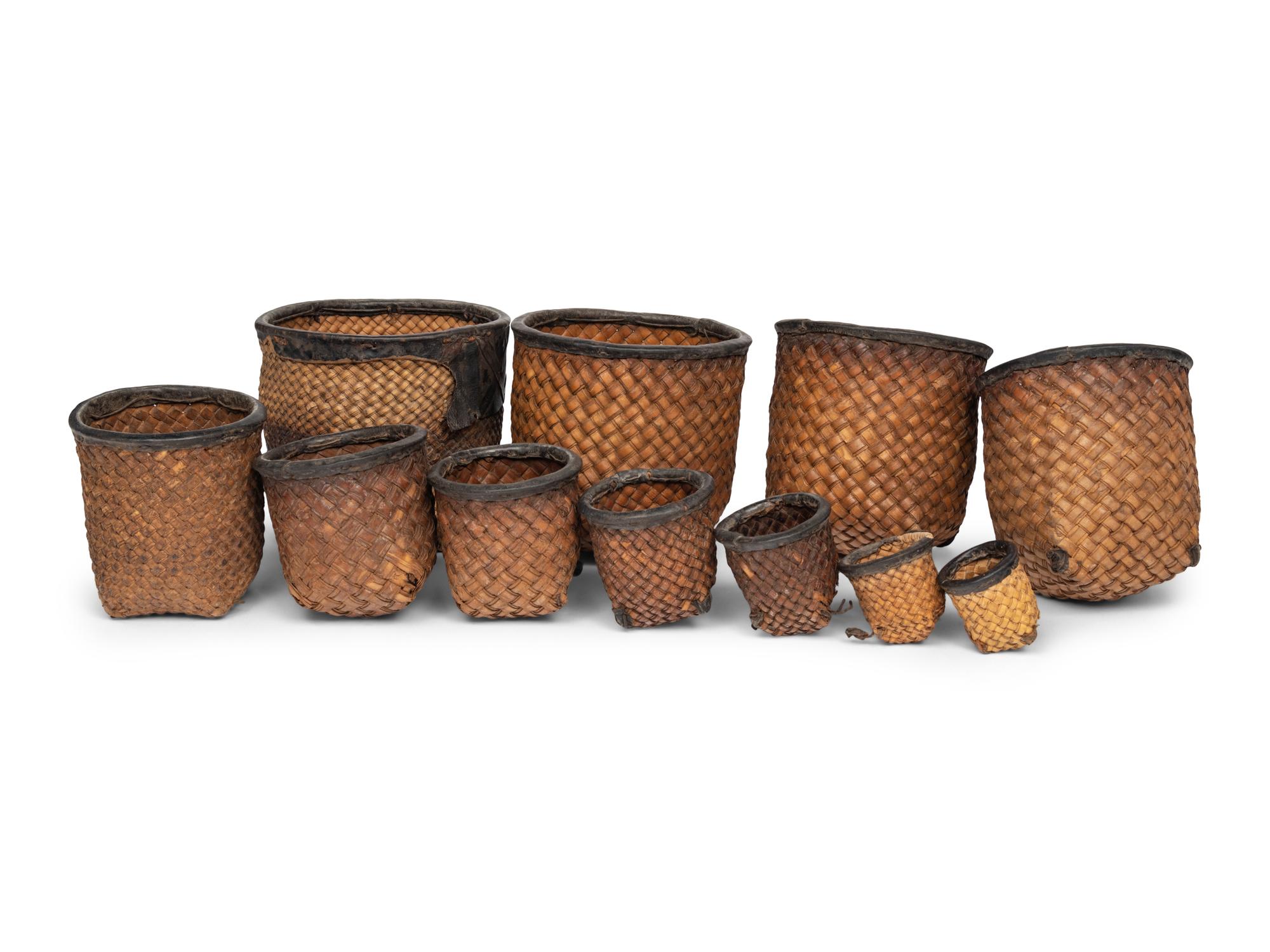 A Set of Eleven Woven and Leather Nesting Baskets