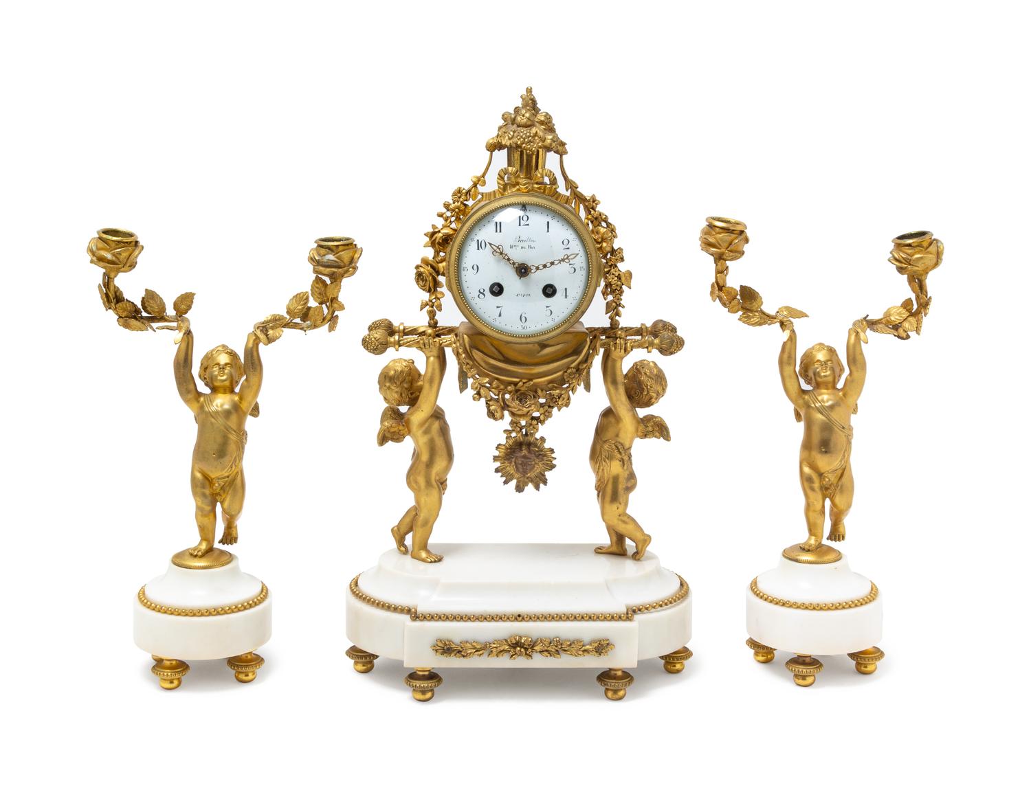 A Louis XVI Gilt Bronze and Marble Three-Piece Clock Garniture