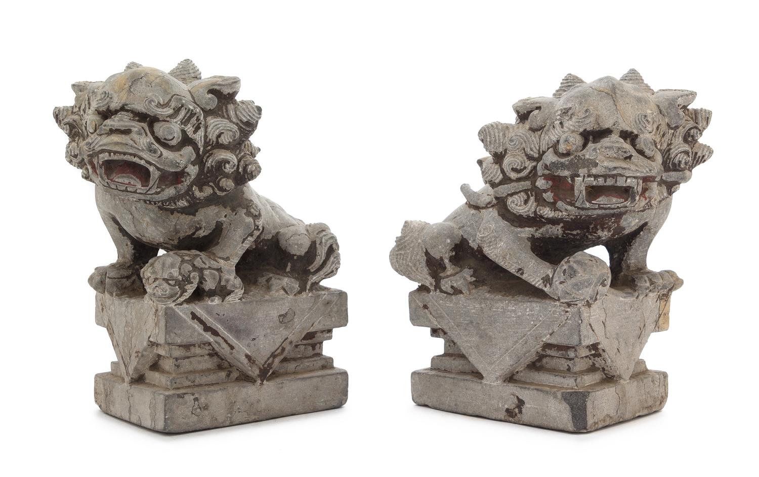 A Pair of Chinese Stone Figures of Buddhist Lions Height of each 10 3/4 inches. — 18TH CENTURY