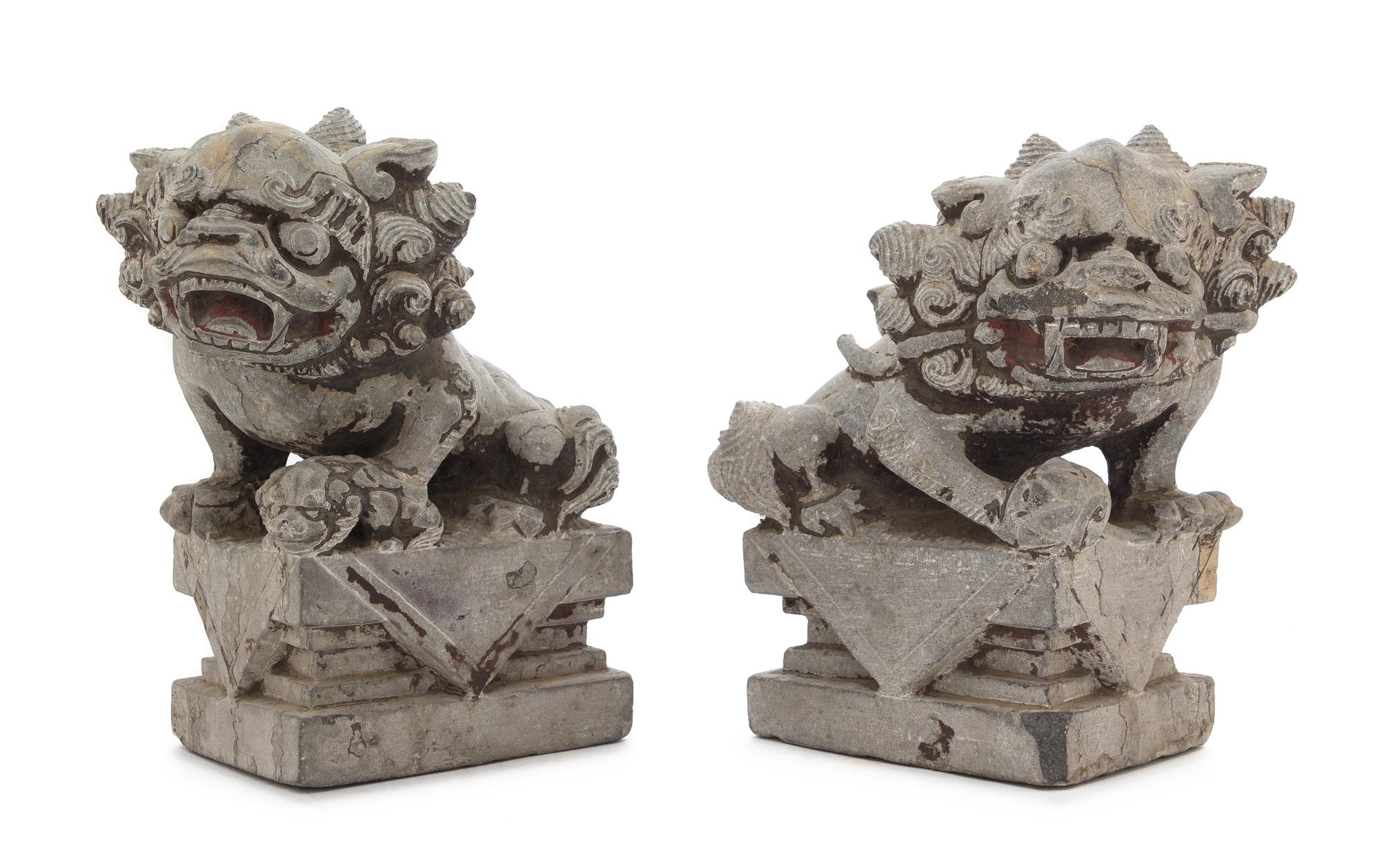 A Pair of Chinese Stone Figures of Buddhist Lions Height of each 10 3/4 inches. — 18TH CENTURY