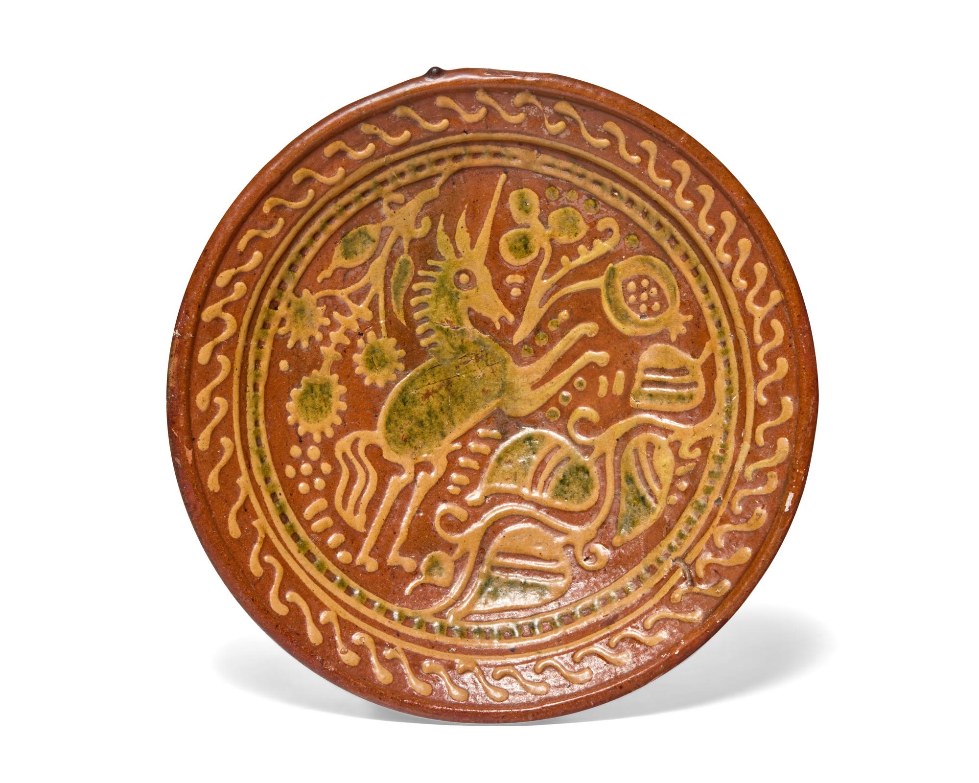 A Dutch Slip-Decorated Earthenware Footed Charger, 17th Century