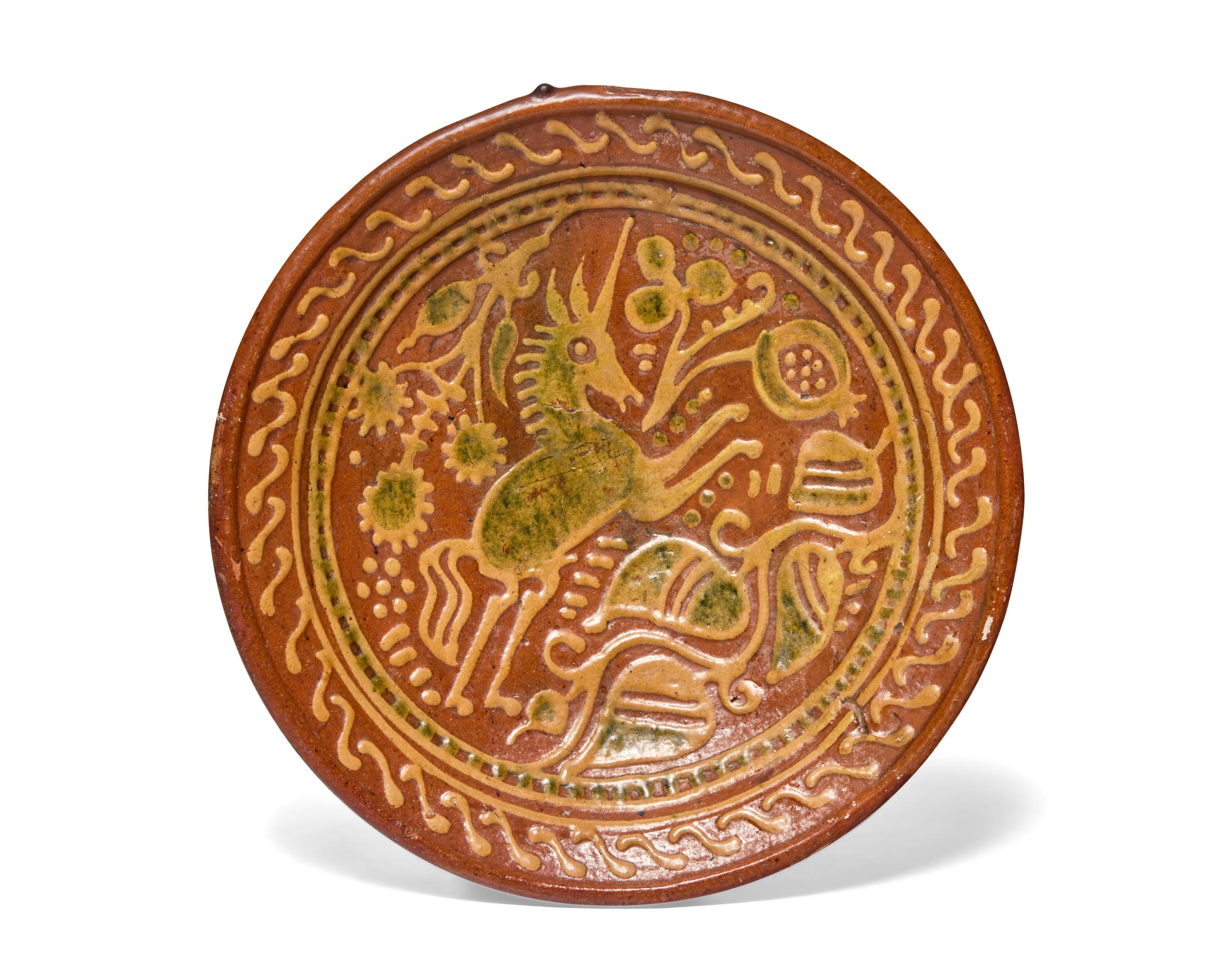 A Dutch Slip-Decorated Earthenware Footed Charger, 17th Century