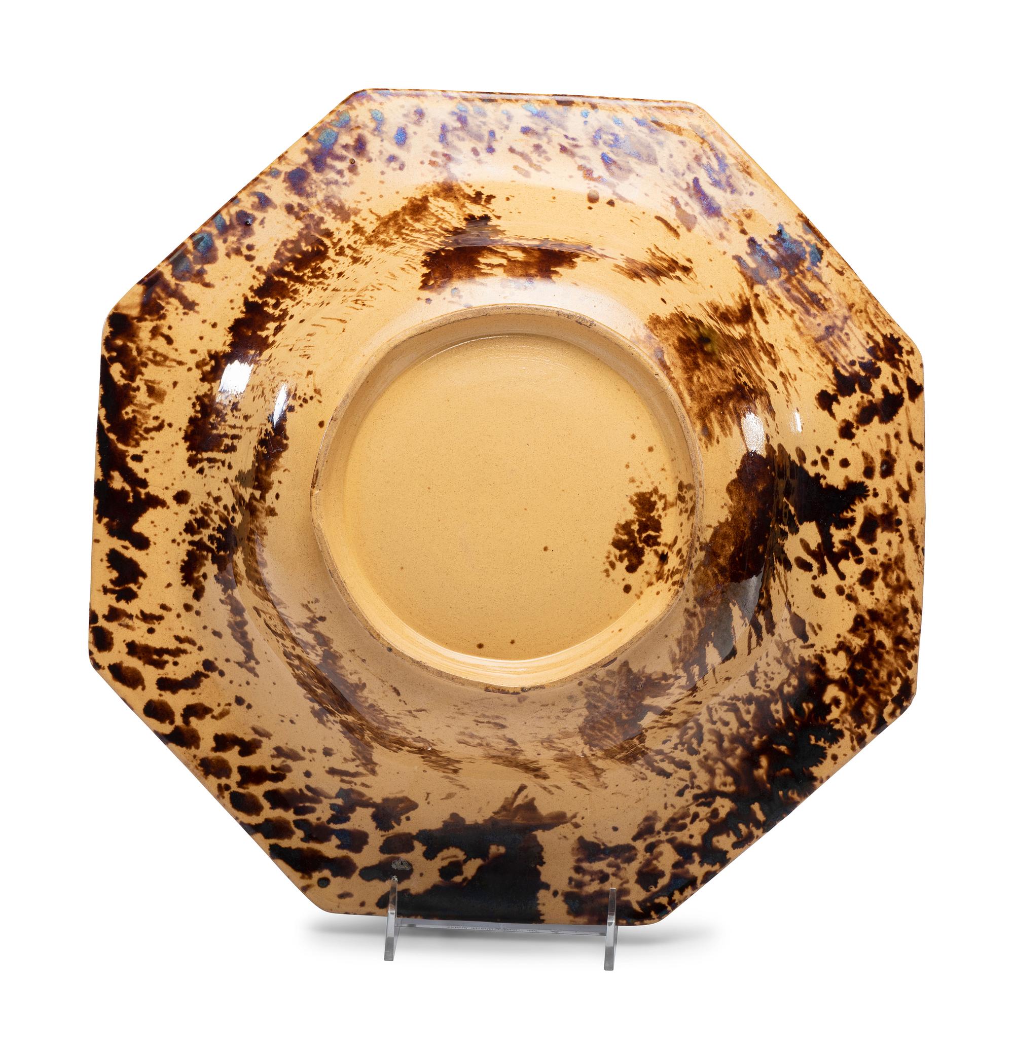 A Large Molded Yellowware Bowl with Flint Enamel Glaze