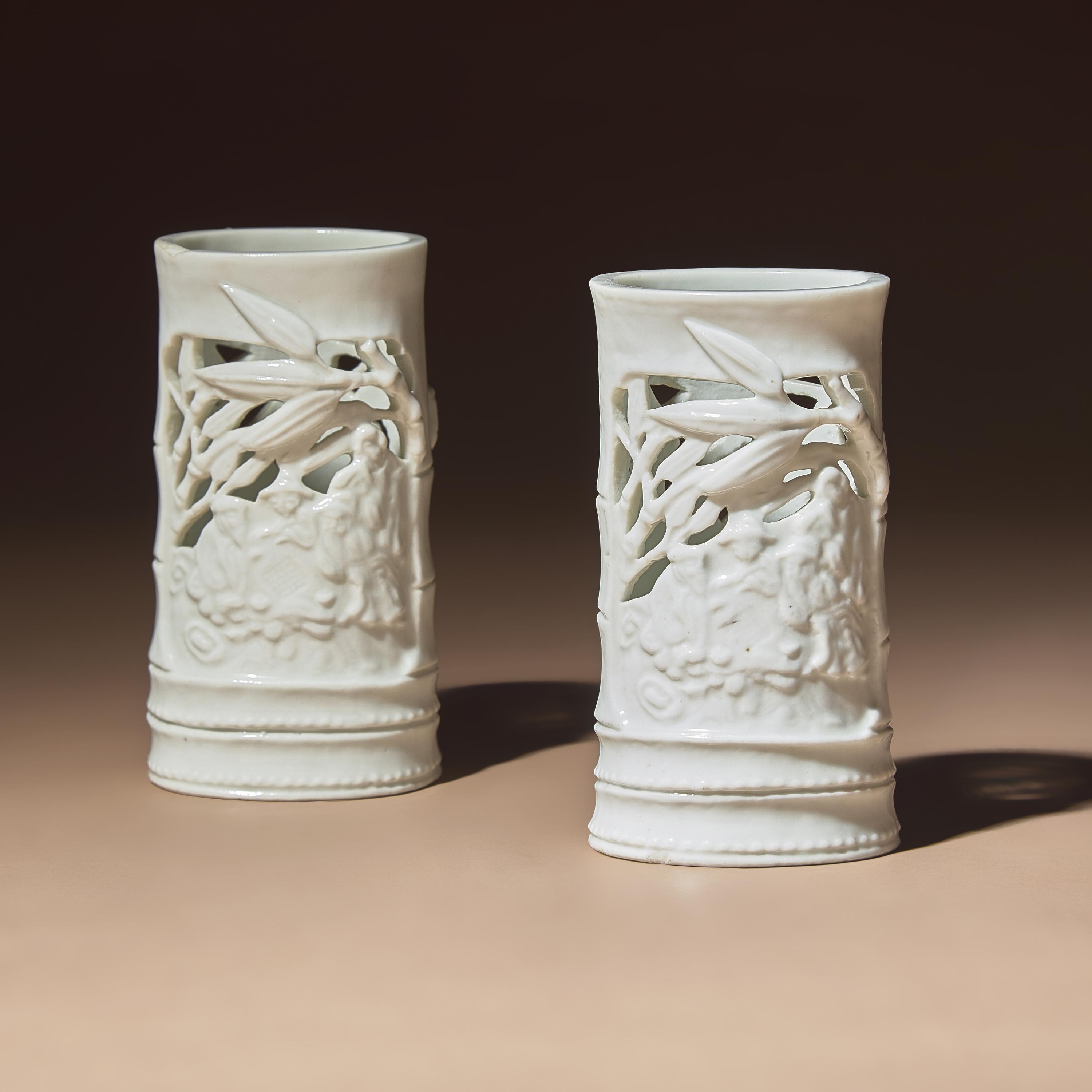 A Pair of Chinese Blanc-de-Chine Reticulated Porcelain 'Scholars' Brush Pots, Bitong, 17th-18th Century — 清早期 德化白瓷鏤雕竹林七賢筆筒一對
