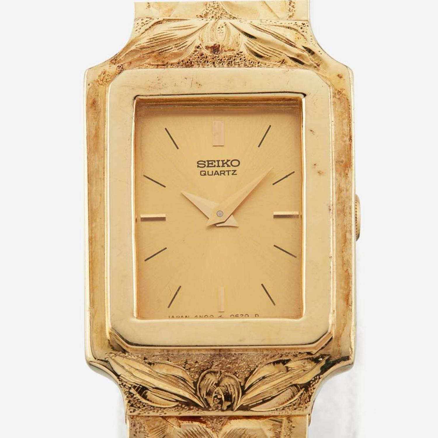 A gold bracelet watch and matching earrings, Seiko