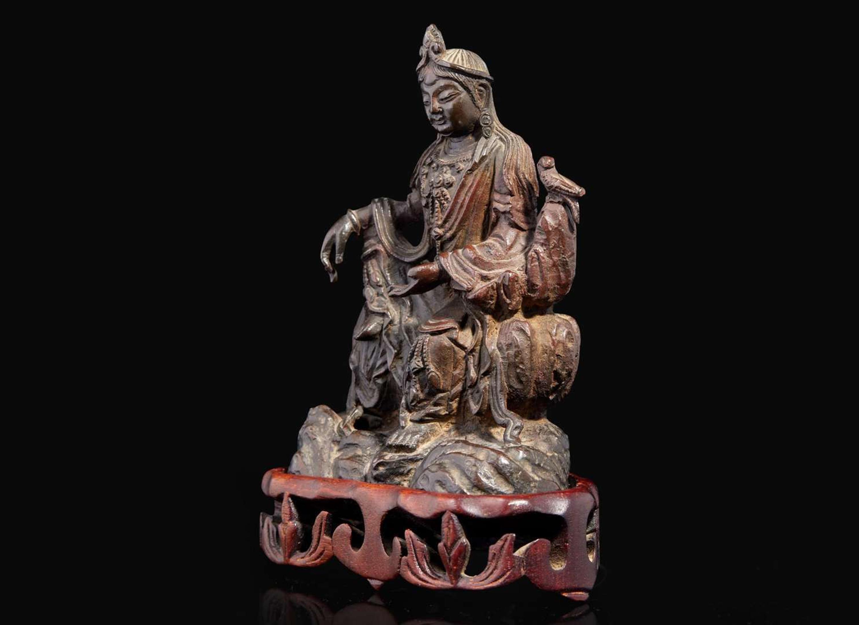 A small patinated bronze figure of "Water-Moon" Guanyin, 17th/18th century or earlier 銅加漆水月觀音像 十七至十八世紀或更早