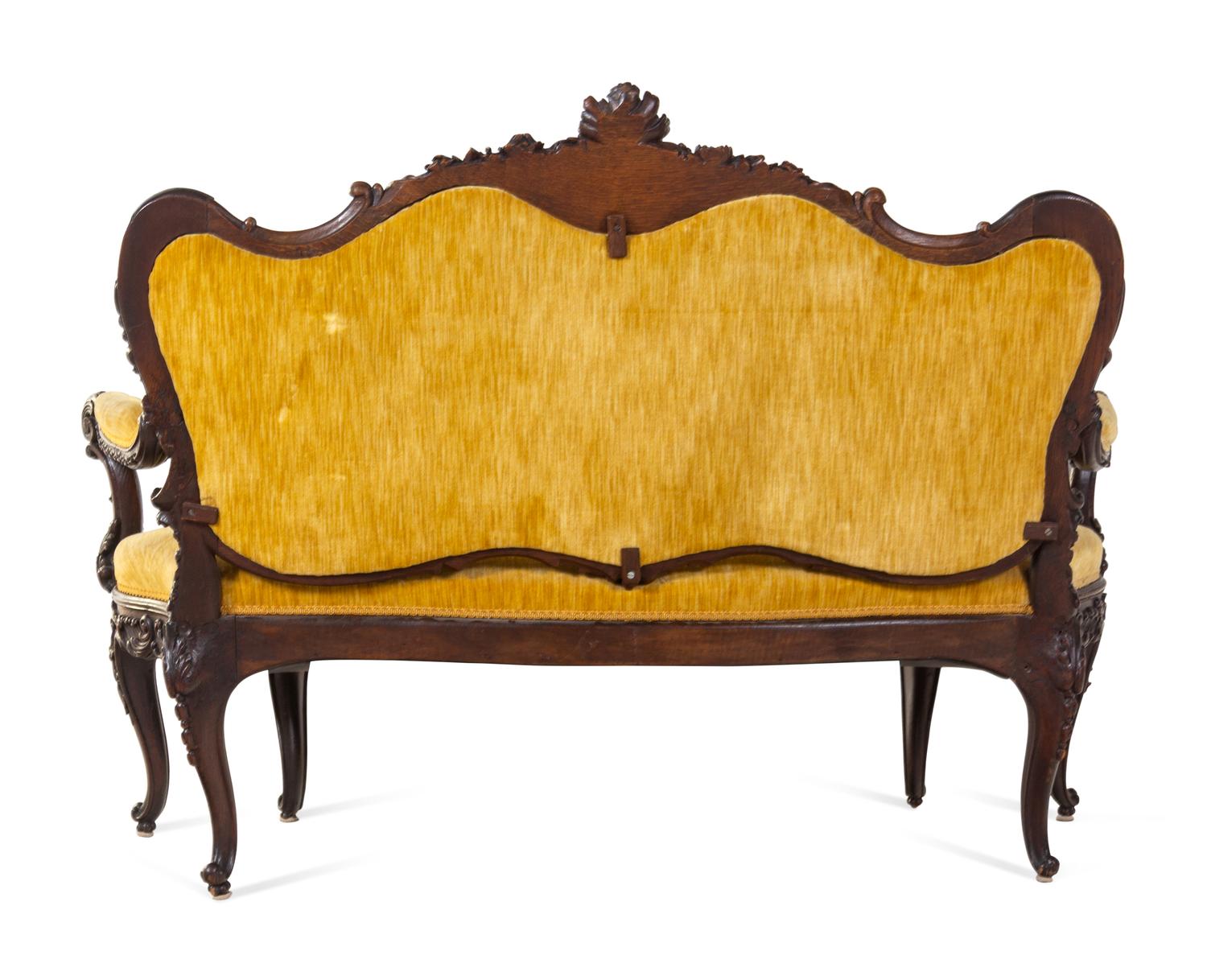A Rococo Revival Carved Walnut Settee