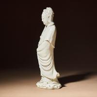 A Chinese Blanc-de-Chine Porcelain Standing Figure of Guanyin with 'He Chaozong' Mark, Qing Dynasty — 清 何朝宗款德化白瓷觀音立像