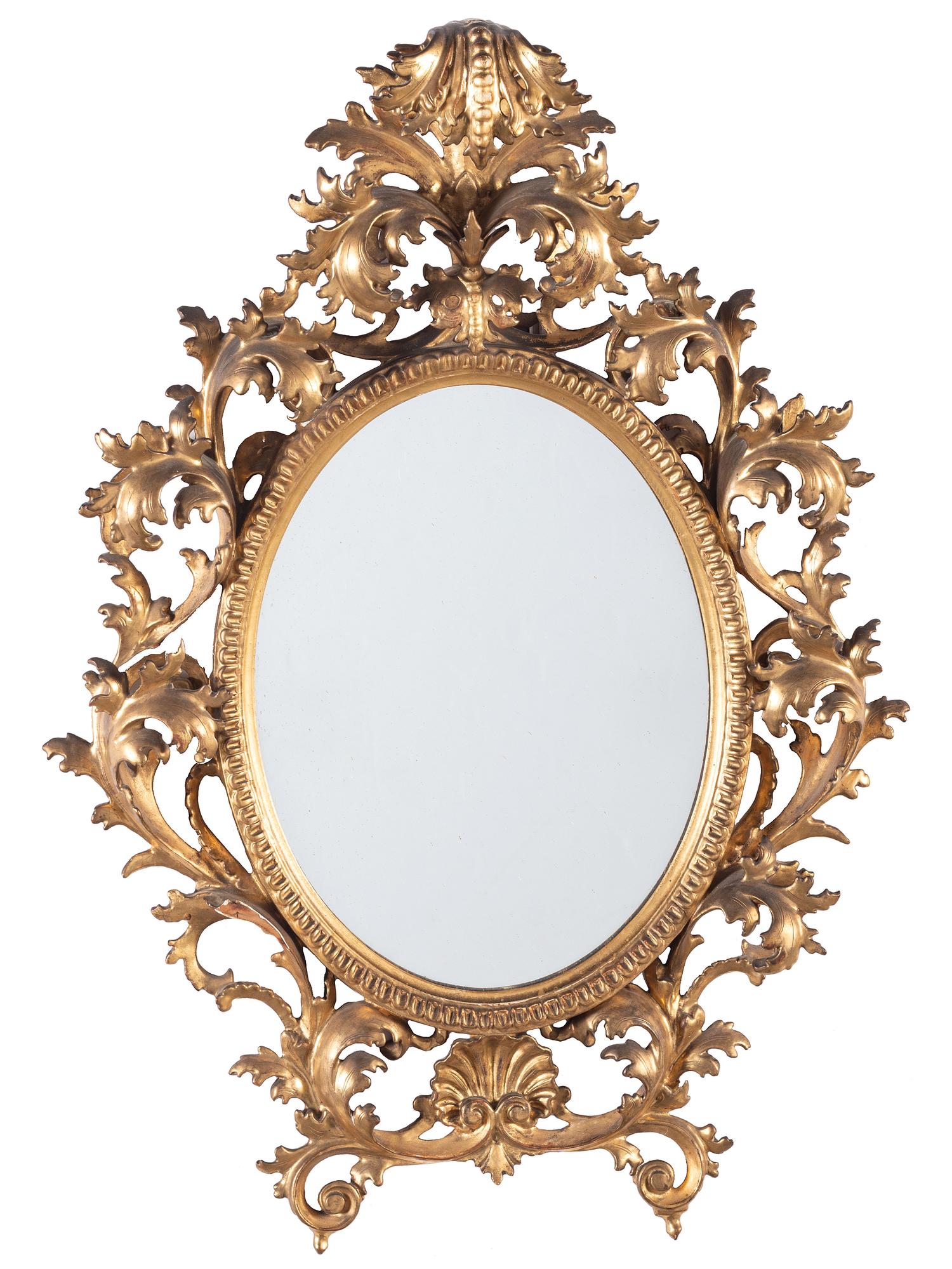 A Continental Baroque Style Giltwood Mirror